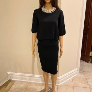 Black jersey suit with the pearls details